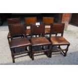 A set of eight brown leather studded dining chairs with turned legs and supports early 20c to