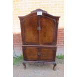 A 1920's burr walnut drinks cabinet est: £100-£150