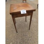 An Edwardian inlaid mahogany envelope card table with green baize interior and terminating on