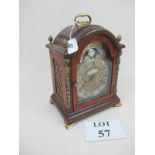 A walnut cased clock with brass mounts s