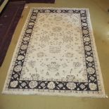 A mid 20c rug on cream ground (238 x 160