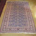 A Persian design rug on cream and blue ground (178cm x 270cm) est: £10-£20