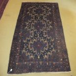 A 20c Persian rug on brown ground (217 x