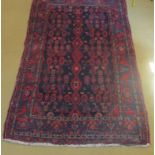 An early mid 20c Persian rug on blue fie