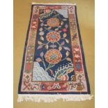 A thick piled chisel design rug depictin