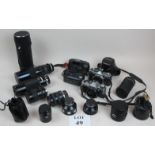 An assortment of old cameras to include Olympus OM2, Olympus OM20,