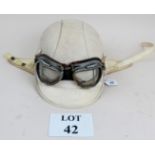 A 1950's motorcycle helmet and glasses est: £40-£60 (AB11)