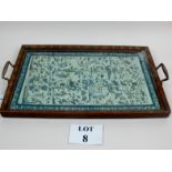 A decorative tray with Chinese silk work under glass est: £50-£80 (G3)