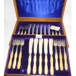 A set of twelve ivory handled silver fis
