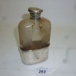 A Victorian hip flask with silver cup an