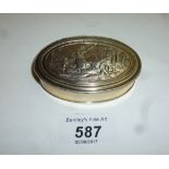 An 18ct silver gilt oval box with figure