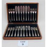 A boxed set of fish knives and forks est
