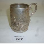 A silver Christening mug with embossed d