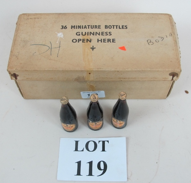 A box of twenty one miniature Guinness b