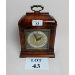 A good quality Georgian style walnut cased Elliott mantel clock retailed by W Greenwood & Sons of