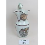 An early 19th century Masonic ceramic jug, prattware colourway, mask spout,