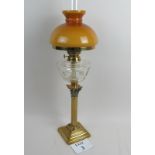 A Victorian brass Corinthian column oil lamp with cut glass reservoir,