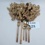 A ninety six piece suite of gilt metal cutlery for twelve place setting,