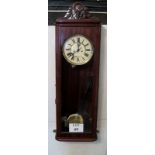 A 19th century continental glazed mahogany cased Vienna type wall clock, pendulum,