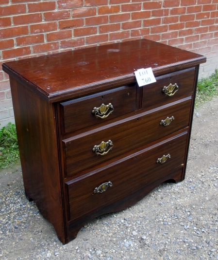 An Edwardian mahogany chest of two short over two long drawers with brass handles est: £40-£60