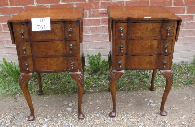 A pair of 20th century Queen Anne design burr walnut bedside tables with drop leaves over three