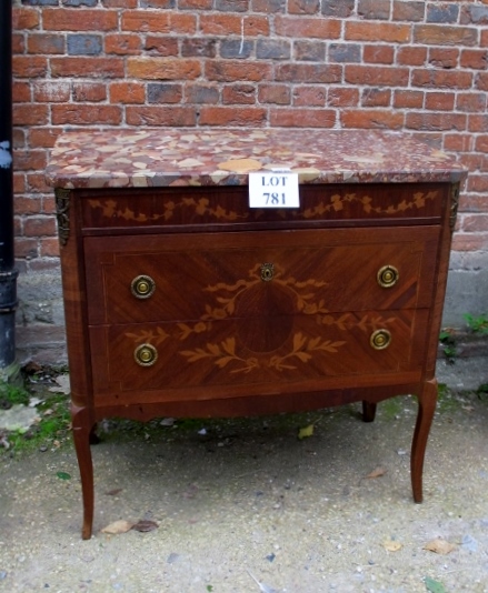 A late 19th century marquetry Louis XVI style chest of two long drawers beneath a marble top and