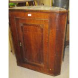 A Georgian oak corner cupboard with panelled door and shaped shelves to interior est: £50-£80