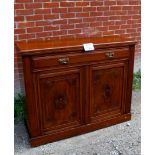 A 19th century mahogany sideboard with single drawer over cupboard doors with carved panels clean
