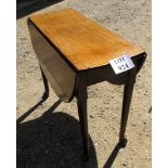 A 19th century mahogany drop leaf gate leg table terminating on pad feet est: £30-£50