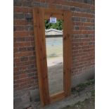 A contemporary rustic oak framed rectangular wall mirror (152 cm x 60 cm approx) est: £40-£60