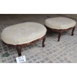 A pair of c1900 walnut carved framed footstools upholstered in cream est: £60-£90