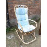 A 20th century bamboo conservatory rocking chair with a loose cushion est: £30-£50