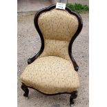 A Victorian ladies nursing chair upholstered in cream floral material (matches previous lot)