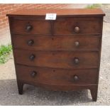 A Victorian mahogany bow front chest of two short over three long drawers with turned handles est: