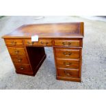 A 19th century oak pedestal desk with tan leather top over nine drawers to base est: £400-£600