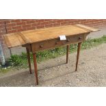 An unusual oak hall table with drop ends over two drawers and terminating on later legs est: