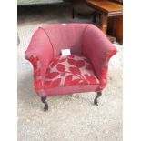 An early 20th century tub chair upholstered in deep red floral material est: £50-80