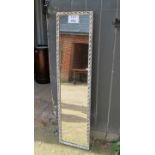 A white painted rectangular wall mirror of slim proportions (slightly a/f) (140 cm x 36 cm approx)
