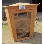 An astral glazed pine corner cupboard with two shelves to interior est: £30-£50