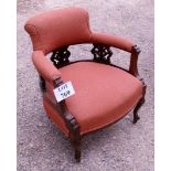 A c1900 mahogany framed tub chair in salmon material in good condition est: £40-£60