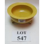 A Chinese yellow bowl on three feet with