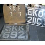 Three original old vehicle number plates