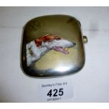 A cigarette case enamelled with dogs hea