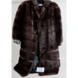 A knee length mink fur coat in excellent