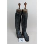 A pair of vintage leather riding boots w