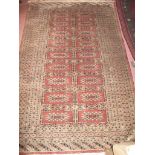 A mid 20th century Persian rug on cream