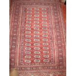A 20th century Persian rug on terracotta