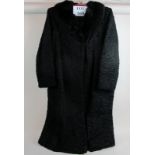 A vintage astrakhan coat est: £30-£50 (C