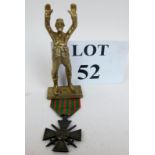 A French WWI medal and a German brass soldier car mascot 'Boche' est: £20-£30 (N2)