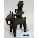 An antique naive ethnic bronze figure of a man riding a horse, probably Benin, 18.